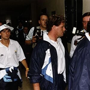 Paul Gascoigne surrounded by phpotographers and reporters after he walked silently out of