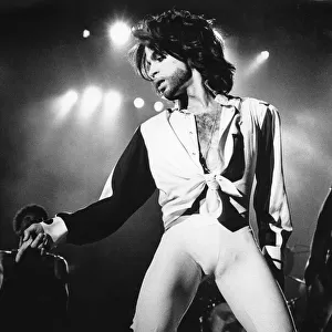 Prince performing on stage during The Nude Tour