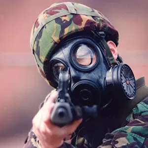 A Royal Marine in camouflage and gasmask