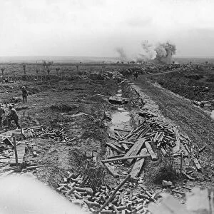 Shells bursting in the distance on newly captured ground taken from the main road to