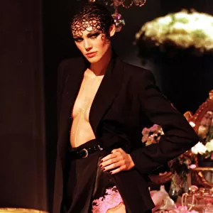 Shirley Mallman at Paris Fashion Week 1997 models a black velvet suit with cameo knickers