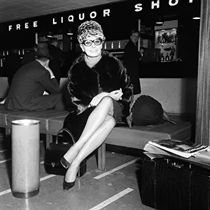 Sophia Loren at London Airport, leaving for Paris where she will do some shopping prior