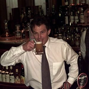 Tony Blair Labour Party leader in a pub drinking a half pint of beer named after him