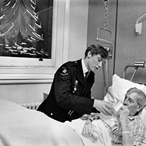 Volunteer Labour in Hospitals. 15 year old Robert Newport helping the Nurse in charge of