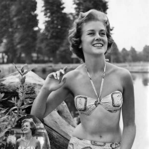 Woman wearing a bikni during a day out. July 1959 P018020