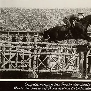 1936 Berlin Olympic Games: jockey and horse jump an obstacle
