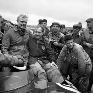 <b class=qtipBold><figcaption>24 Hours-Le Mans-1955-Hawthorn-Bueb</figcaption></b><br>British driver Mike Hawthorn (L) and his teammate Ivor Bueb (R) celebrate in their Jaguar D-Type on Le Mans racetrack, as they have won the 23th edition of the 24 hours of Le Mans race, on June 12, 1955. The 23th edition of the endurance race was marked by the terrible crash that killed 82 persons, in which French pilot Pierre Levegh, and injured 77 others. In terms of human toll, it is the most catastrophic accident in motorsports history. / AFP PHOTO<br><em>© Copyright Agence France-Presse (AFP) - All Rights Reserved</em> 24 Hours-Le Mans-1955-Hawthorn-Bueb