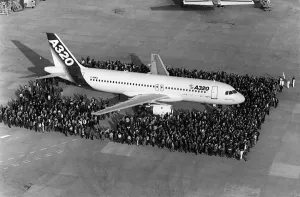 <b class=qtipBold><figcaption>Airbus-A320-First Flight</figcaption></b><br>Employees of Aerospatiale pose near the new Airbus A320 airliner before its inaugural flight, 22 February 1987. The Airbus A320 airliner, a significant sales success and a technological trailblazer, is one of the most produced airliner in the world. It made his first flight 22 February 1987. / AFP PHOTO / JEAN-PIERRE MULLER<br><em>© Copyright Agence France-Presse (AFP) - All Rights Reserved</em> Airbus-A320-First Flight