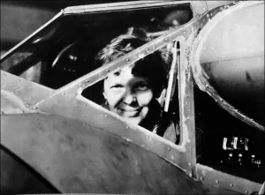 Amelia Earhart looking through the cockpit window
