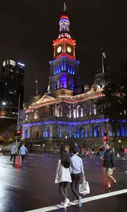 <b class=qtipBold><figcaption>Australia-France-Attacks</figcaption></b><br>People walk past the Sydney Town Hall as it is lit in red, white and blue, resembling the colours of the French flag, in Sydney on November 14, 2015, as Australians express their solidarity with France following a spate of coordinated attacks that left 128 dead and 180 injured in Paris late on November 13. Both the Opera House and the Sydney Town Hall were bathed in the French colours and New South Wales state Premier Mike Baird said he had also asked for a French flag to fly over the city's famous harbour bridge. AFP PHOTO / William WEST / AFP PHOTO / WILLIAM WEST<br><em>© Copyright Agence France-Presse (AFP) - All Rights Reserved</em> Australia-France-Attacks