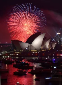 <b class=qtipBold><figcaption>Australia-New Year</figcaption></b><br>Fireworks light up the sky over Sydney's Opera House (L) and Harbour Bridge during New Year celebrations in Sydney on January 1, 2016. AFP PHOTO / Saeed KHAN / AFP PHOTO / SAEED KHAN<br><em>© Copyright Agence France-Presse (AFP) - All Rights Reserved</em> Australia-New Year