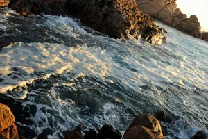 <b class=qtipBold><figcaption>AUSTRALIA-THEME-TOURISM</figcaption></b><br>Foam sits on top of sea-water as it surges through the protruding rock formations of Canal Rocks at Yallingup in the world-renowned surfing area of the south-west corner of Western Australia are shown in this photo taken on May 11, 2011. The legendary coastline with its amazing surf breaks, spans an area between Cape Naturaliste and Cape Leeuwin and is also famous for its premium wine growing, pristine white sandy beaches and spectacular forest scenery. AFP PHOTO / Greg WOOD / AFP PHOTO / GREG WOOD<br><em>© Copyright Agence France-Presse (AFP) - All Rights Reserved</em> AUSTRALIA-THEME-TOURISM