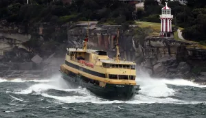 <b class=qtipBold><figcaption>Australia-Weather-Ferry</figcaption></b><br>Sydney's Manly ferry ploughs through the waves after gale force winds, torrential rain and snow wreaked havoc across Sydney and surrounding areas on October 15, 2014. The New South Wales State Emergency Services (SES) responded to more than 1, 200 calls for help overnight as wind gusts of up to 160 kph (100 mph) brought down trees and up 170 mm (6.7 inches) of rain caused widespread flooding. AFP PHOTO/William WEST / AFP PHOTO / WILLIAM WEST<br><em>© Copyright Agence France-Presse (AFP) - All Rights Reserved</em> Australia-Weather-Ferry