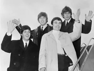 Beatles salute as they leave London, June 1964 Beatles salute as they leave London, June 1964