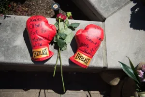 Prints of Boxing gloves are seen outside the Muhammad Ali Center near a makeshift memorial for the legendary boxer June 8, 2016 in Louisville, Kentucky. AFP PHOTO / Michael B. Thomas USA Prints: BOX-US-ALI