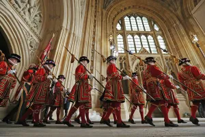 <b class=qtipBold><figcaption>Britain-Royals-Politics</figcaption></b><br>Yeoman of the Guard walk in through the Sovereign's entrance before Britain's Queen Elizabeth II and Prince Philip, Duke of Edinburgh, arrive at the Houses of Parliament on May 18, 2016, for the State Opening of Parliament. The State Opening of Parliament marks the formal start of the parliamentary year and the Queen's Speech sets out the government's agenda for the coming session. / AFP PHOTO / POOL / Dan Kitwood<br><em>© Copyright Agence France-Presse (AFP) - All Rights Reserved</em> Britain-Royals-Politics