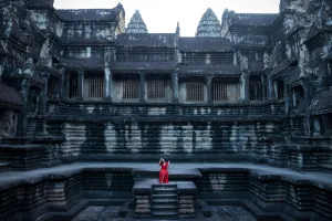 <b class=qtipBold><figcaption>Cambodia-Travel-Angkor Wat</figcaption></b><br>A woman poses for a photograph as she sits near a stepwell inside the Angkor Wat Temple in Siem Reap. AFP PHOTO / CHANDAN KHANNA / AFP PHOTO / Chandan Khanna<br><em>© Copyright Agence France-Presse (AFP) - All Rights Reserved</em> Cambodia-Travel-Angkor Wat