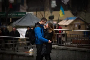 A couple stands on Independence square in Kiev, on February 14, 2014 A couple stands on Independence square in Kiev, on February 14, 2014