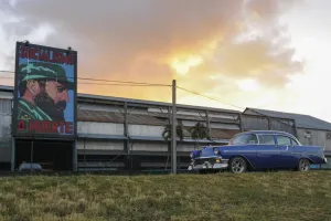 <b class=qtipBold><figcaption>Cuba-Castro-Classic Car</figcaption></b><br>A car drives past a poster of Cuban former president Fidel Castro reading Socialism or Death in Havana on November 26, 2016. AFP PHOTO / YAMIL LAGE<br><em>© Copyright Agence France-Presse (AFP) - All Rights Reserved</em> Cuba-Castro-Classic Car