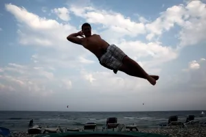 <b class=qtipBold><figcaption>CYPRUS-BEACH-KITE SURF</figcaption></b><br>A Cypriot enjoys a trampoline at Mazotos' Kahuna beach on July 20, 2014, east of the Mediterranean island of Cyprus. AFP PHOTO / YIANNIS KOURTOGLOU / AFP PHOTO / Yiannis Kourtoglou<br><em>© Copyright Agence France-Presse (AFP) - All Rights Reserved</em> CYPRUS-BEACH-KITE SURF