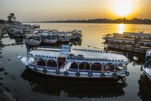 <b class=qtipBold><figcaption>Egypt-Nile-Feature</figcaption></b><br>A picture taken on September 10, 2017 shows river boats moored in the Nile at a marina at sunrise in the southern Egyptian city of Luxor. / AFP PHOTO / KHALED DESOUKI<br><em>© Copyright Agence France-Presse (AFP) - All Rights Reserved</em> Egypt-Nile-Feature