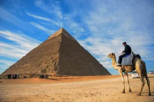 <b class=qtipBold><figcaption>Egypt-Pyramid-Travel-Camel</figcaption></b><br>A picture taken on December 6, 2017 shows an Egyptian policeman riding a camel near the pyramid of Khafre (also spelled Chephren) on the Giza Plateau on the southwestern outskirts of the capital Cairo. / AFP PHOTO / MOHAMED EL-SHAHED<br><em>© Copyright Agence France-Presse (AFP) - All Rights Reserved</em> Egypt-Pyramid-Travel-Camel