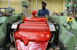 An employee pours oil paint in a workshop at the Raphael-Isabey-Sennelier factory in Saint-Brieuc
