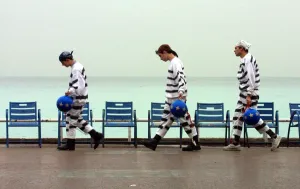 <b class=qtipBold><figcaption>FRANCE-EU-SUMMIT-PROTEST</figcaption></b><br>Three men, wearing mock prisoner uniforms, carry Euro-colored balls and chains 08 December 2000 on the seaside Promenade des Anglais in the southeastern French city of Nice to protest the ongoing European Union summit. AFP PHOTO PATRICE LAPOIRIE / AFP PHOTO / PATRICE LAPOIRIE<br><em>© Copyright Agence France-Presse (AFP) - All Rights Reserved</em> FRANCE-EU-SUMMIT-PROTEST