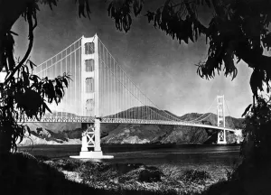 <b class=qtipBold><figcaption>GOLDEN GATE BRIDGE</figcaption></b><br>Picture dated 1950's of the Golden Gate bridge, in the San Francisco Bay. Construction began on 05 January 1933 and the bridge was inaugurated 27 May 1937 by Franklin Delano Roosevelt, who pushed a button in Washington, DC, signaling the official start of vehicle traffic over the Bridge. Idea of the engineer Joseph Strauss, it was the largest suspension bridge in the world. / AFP PHOTO / -<br><em>© Copyright Agence France-Presse (AFP) - All Rights Reserved</em> GOLDEN GATE BRIDGE