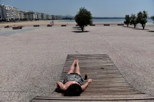 <b class=qtipBold><figcaption>Greece-Weather-Heatwave-Travel</figcaption></b><br>A woman sunbathes on the seaside promenade in Thessaloniki on June 29, 2017. / AFP PHOTO / SAKIS MITROLIDIS<br><em>© Copyright Agence France-Presse (AFP) - All Rights Reserved</em> Greece-Weather-Heatwave-Travel