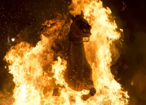 Offbeat Quirky Images Prints: Horseman Jumping a Bonfire during Luminarias