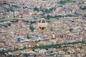 Ballooning Prints: A hot-air balloon flies over Igualada