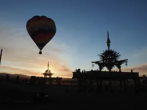 Ballooning Prints: Hot air balloon flies over the Solar Temple at dawn at the Symbiosis Oregon Eclipse Festival