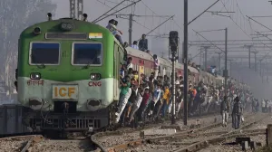 <b class=qtipBold><figcaption>India-Economy-Gdp-Transport</figcaption></b><br>Indian passengers hang onto a train as it departs from a station on the outskirts of New Delhi on February 28, 2017. / AFP PHOTO / Prakash SINGH<br><em>© Copyright Agence France-Presse (AFP) - All Rights Reserved</em> India-Economy-Gdp-Transport