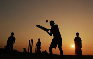 <b class=qtipBold><figcaption>India-New Year-Cricket</figcaption></b><br>Indian boys play cricket at sunset in Joypur near Agartala, the state capital of India's northeastern state of Tripura. AFP PHOTO/STR / AFP PHOTO / STR<br><em>© Copyright Agence France-Presse (AFP) - All Rights Reserved</em> India-New Year-Cricket