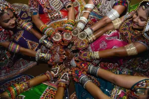 <b class=qtipBold><figcaption>India-Religion-Hindu</figcaption></b><br>Indian folk dancers display ornaments during a break while participating in the first night of Navratri in Gandhinagar, some 30 km from Ahmedabad, on October 13, 2015. Navratri festivities, or Dance Festival of Nine Nights, takes place between October 13-21. AFP PHOTO / Sam PANTHAKY / AFP PHOTO / SAM PANTHAKY<br><em>© Copyright Agence France-Presse (AFP) - All Rights Reserved</em> India-Religion-Hindu