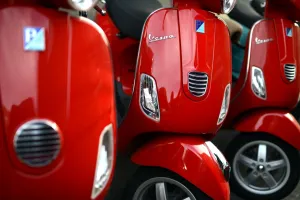 <b class=qtipBold><figcaption>ITALY-ART-THEME-COLORS-VESPA</figcaption></b><br>Red Vespas are parked in a street in Rome. AFP PHOTO / GABRIEL BOUYS / AFP PHOTO / GABRIEL BOUYS<br><em>© Copyright Agence France-Presse (AFP) - All Rights Reserved</em> ITALY-ART-THEME-COLORS-VESPA