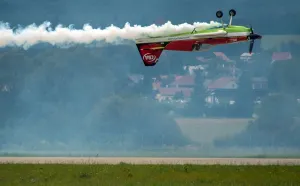 Legendary acrobatic pilot Zoltan Veres of Hungary on his MXS aircraft demonstrates Legendary acrobatic pilot Zoltan Veres of Hungary on his MXS aircraft demonstrates