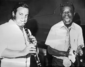 Louis Armstrong playing with French trumpeter Maxime Saury