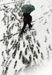 A man walks with his umbrella under snow in downtown Belgrade, 06 March 2006 A man walks with his umbrella under snow in downtown Belgrade, 06 March 2006