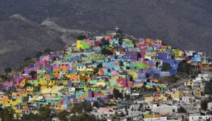 <b class=qtipBold><figcaption>Mexico-Violence-Painted Houses</figcaption></b><br>View of houses on a hill painted with vivid colours in Pachuca, Hidalgo, Mexico on April 4, 2017. The initiative, promoted by the Crime Prevention Secretariat seeks to motivate young people from communities under pressure of violence to participate and paint murals in their communities. / AFP PHOTO / YURI CORTEZ<br><em>© Copyright Agence France-Presse (AFP) - All Rights Reserved</em> Mexico-Violence-Painted Houses