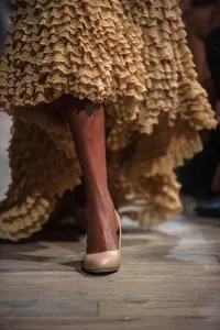 A model presents creations of South African designer Coleen Eitzen during the three A model presents creations of South African designer Coleen Eitzen during the three
