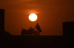 <b class=qtipBold><figcaption>Morocco-Biker-Women</figcaption></b><br>Mai Zniber, a Moroccan therapist poses at sunset next to her Harley Davidson motorbike on December 24, 2015 in the Moroccan capital Rabat. Mai has been riding a motorbike for four years and for her biking gives her a sense of freedom, self-confidence and pushes her limits with the bikes power and potential. / AFP PHOTO / FADEL SENNA<br><em>© Copyright Agence France-Presse (AFP) - All Rights Reserved</em> Morocco-Biker-Women