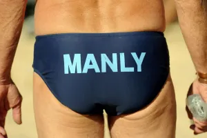 <b class=qtipBold><figcaption>OLY-2012-AUS-MANLY</figcaption></b><br>The word 'Manly' is displayed on the bathers of a member of the Manly Surf Life Saving Club near Sydney on May 13, 2012. The Manly club is something of a breeding ground for elite athletes, with members competing at the Olympics since 1908, including champion swimmers, kayakers and even one winter Olympics skiier among them. AFP PHOTO / Greg WOOD / AFP PHOTO / GREG WOOD<br><em>© Copyright Agence France-Presse (AFP) - All Rights Reserved</em> OLY-2012-AUS-MANLY