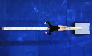 <b class=qtipBold><figcaption>Oly2000-Gym-Feature</figcaption></b><br>An unidentified gymnast performs on the beam 17 September, 2000 at the Olympic Superdome during the women's qualifying phase of the Sydney Olympic Games. AFP PHOTO Joel SAGET / AFP PHOTO / JOEL SAGET<br><em>© Copyright Agence France-Presse (AFP) - All Rights Reserved</em> Oly2000-Gym-Feature