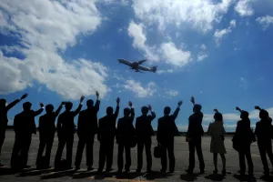 <b class=qtipBold><figcaption>Philippines-Japan-Travel-Plane</figcaption></b><br>Personnel from the Japanese embassy wave to the plane carrying Japan's Emperor Akihito and Empress Michiko as they depart from the Villamor Airbase in Manila on January 30, 2016. AFP PHOTO / NOEL CELIS / AFP PHOTO / NOEL CELIS<br><em>© Copyright Agence France-Presse (AFP) - All Rights Reserved</em> Philippines-Japan-Travel-Plane