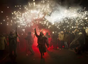 A reveller wearing a demon costume takes part in the traditional festival of Correfoc" A reveller wearing a demon costume takes part in the traditional festival of Correfoc"