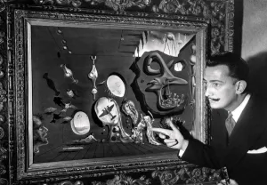 Salvador Dali poses in front of one his paintings Salvador Dali poses in front of one his paintings