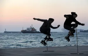 Two Skaters Jump on the Sevastopol Embankment Two Skaters Jump on the Sevastopol Embankment