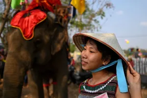 A spectator waits for the start of the elephant race during the Buon Don elephant festival in Vietnams central highlands of Dak Lak province